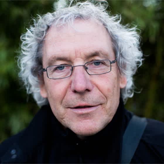 Das Bild zeigt den Mobilitätsforscher Prof. Dr. Andreas Knie, einen älteren Herren mit grauen Haaren und Brille.
