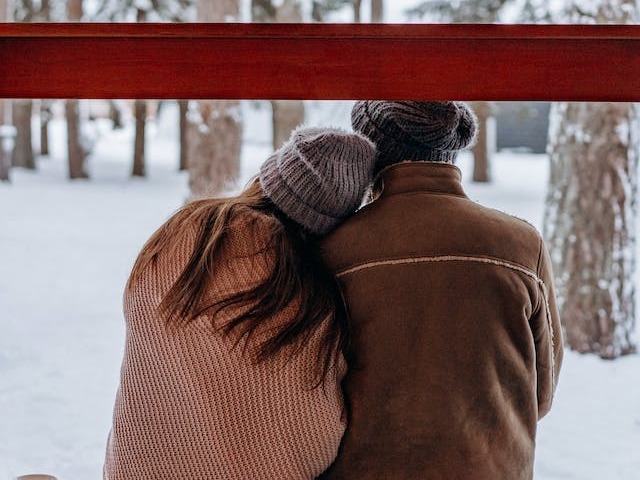 man and woman snow