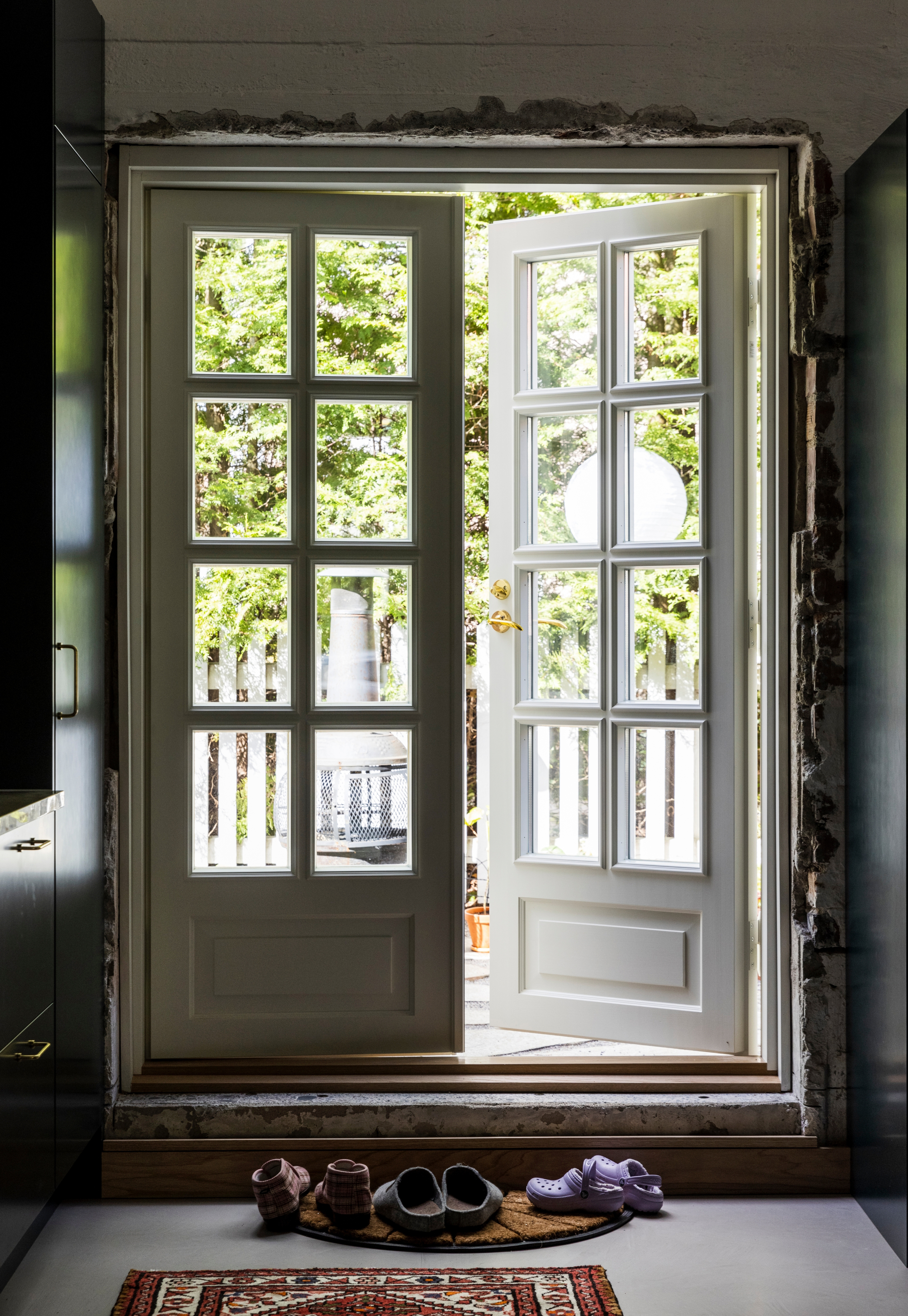 Double doors to the fenced courtyard