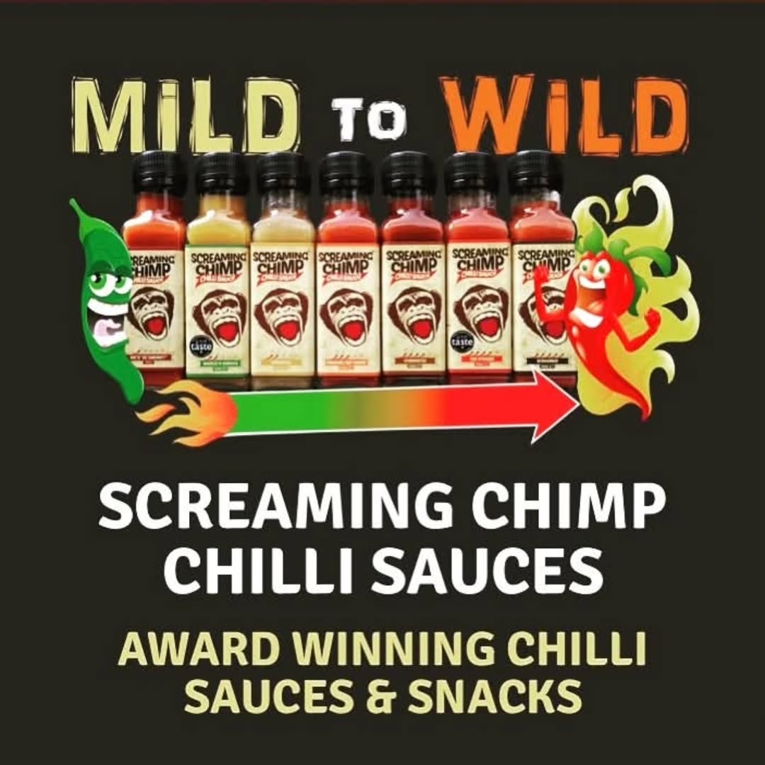 Screaming Chimp hot sauces lined up with chillies