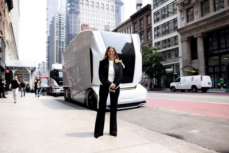 Linnéa Kornehed Falck stands in front of Einride's autonomous vehicle in NYC
