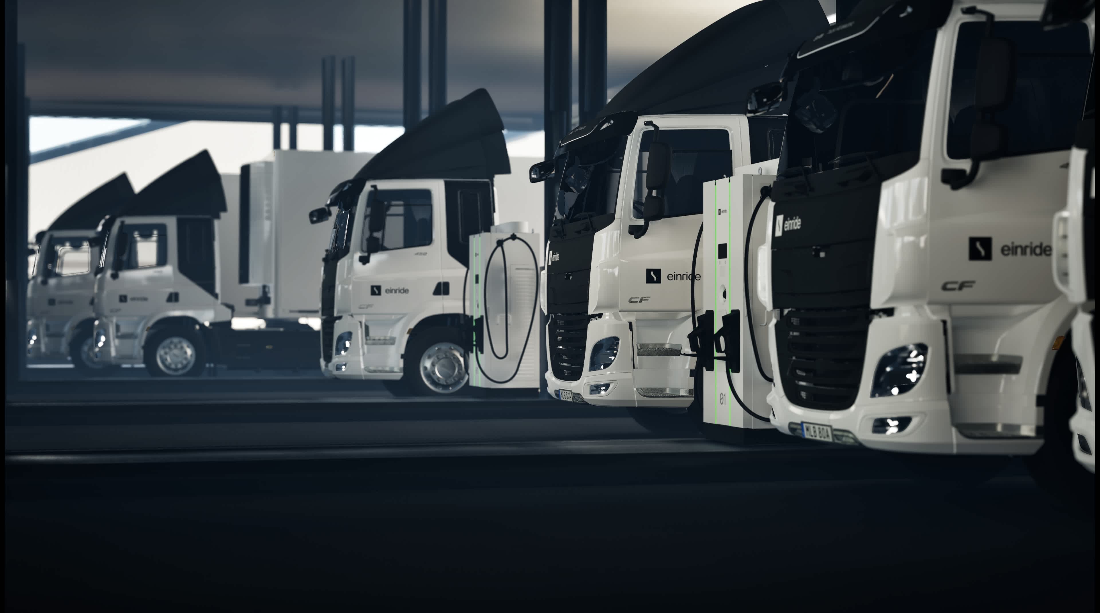 Electric trucks charging at an Einride Station