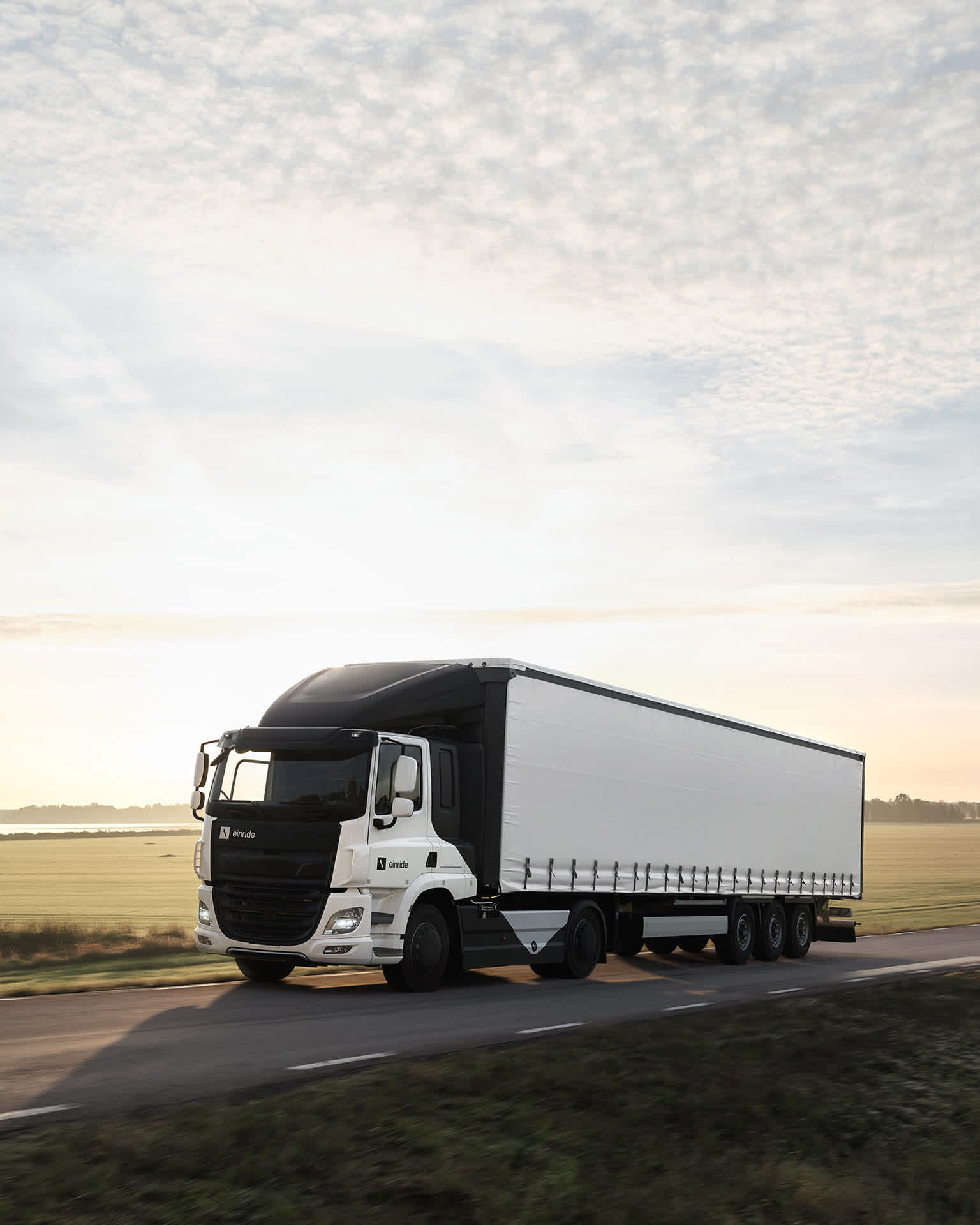 Einride e-truck operating in a country road at sunrise