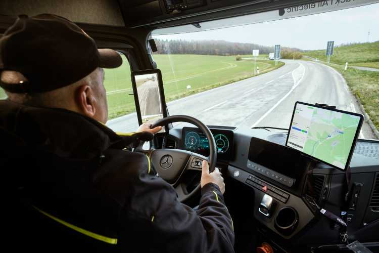 Truck driver inside electric heavy-duty vehicle from Einride's freight mobility platform