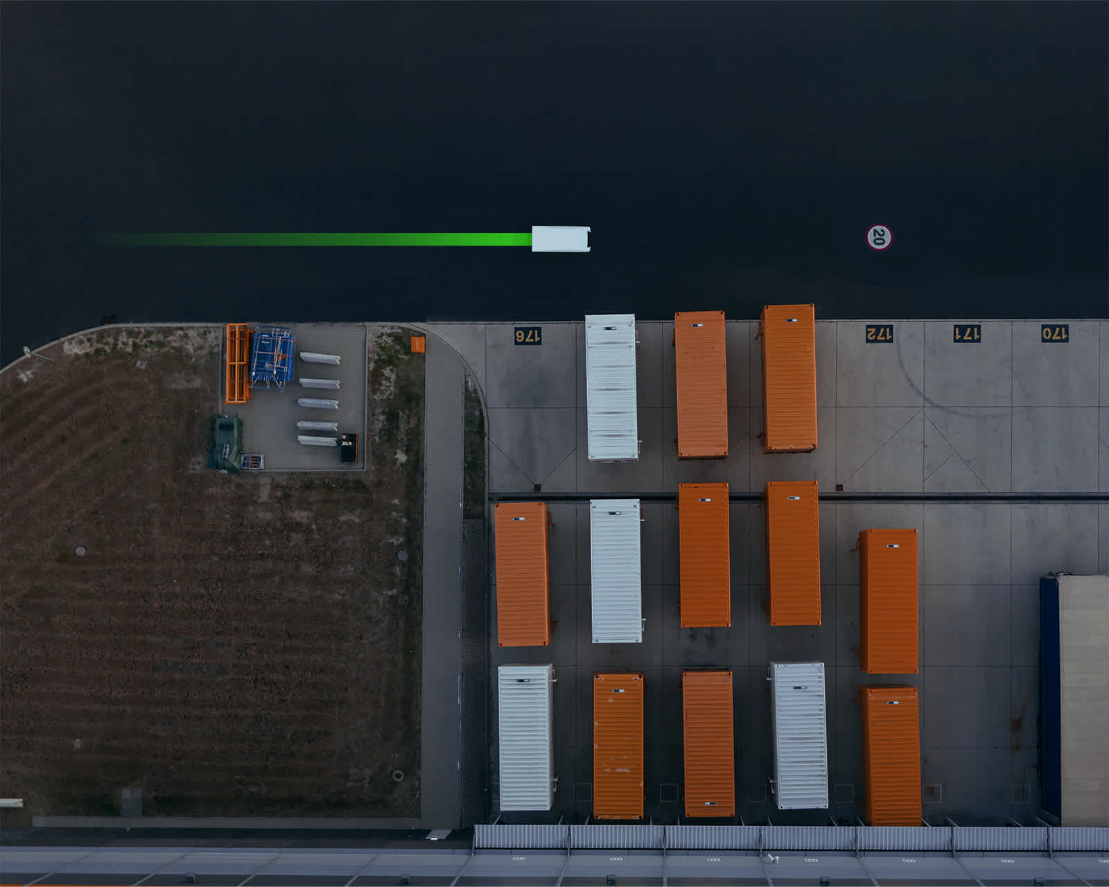 Pod in an industrial environment with shipping containers