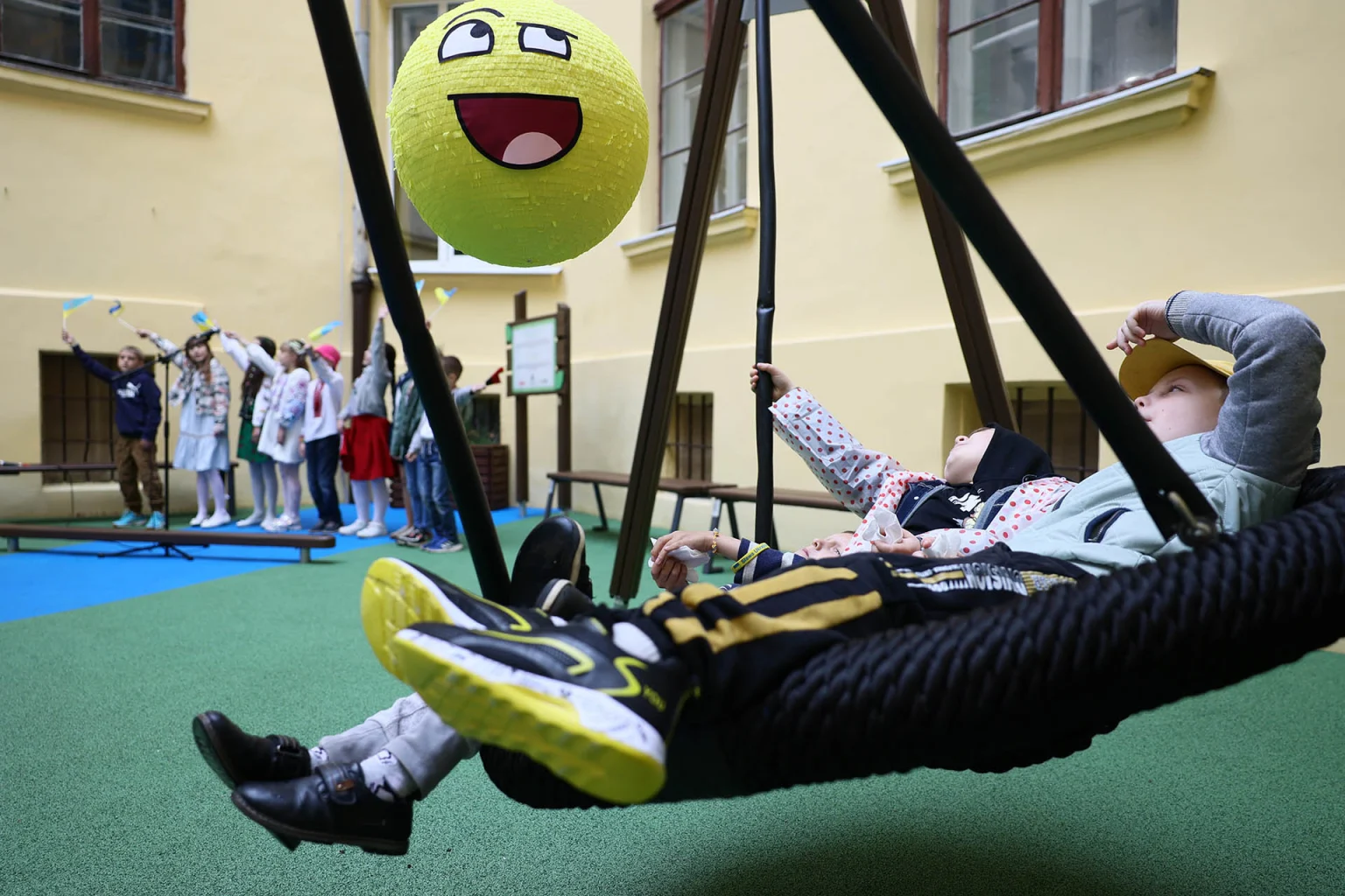 Kids in the birdsnest swing