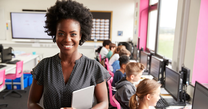 A teacher in her classroom computer lab.