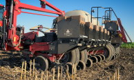 Side view of SIMPAS equipment attached to a Case IH tractor