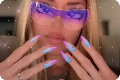 Paige Piskin models her Doll Nails Lens with sparkling purple sunglasses and ombré flame nails.