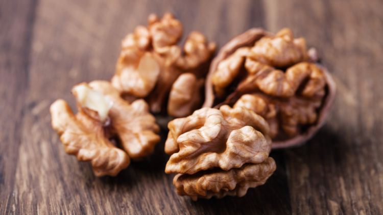 Cracked walnuts with fungal growth
