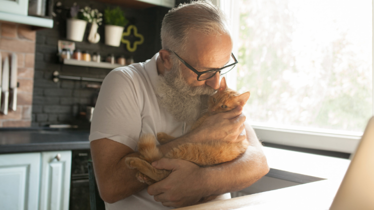 old man with cat companion