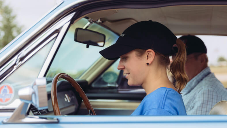 Young driver getting a driving lesson