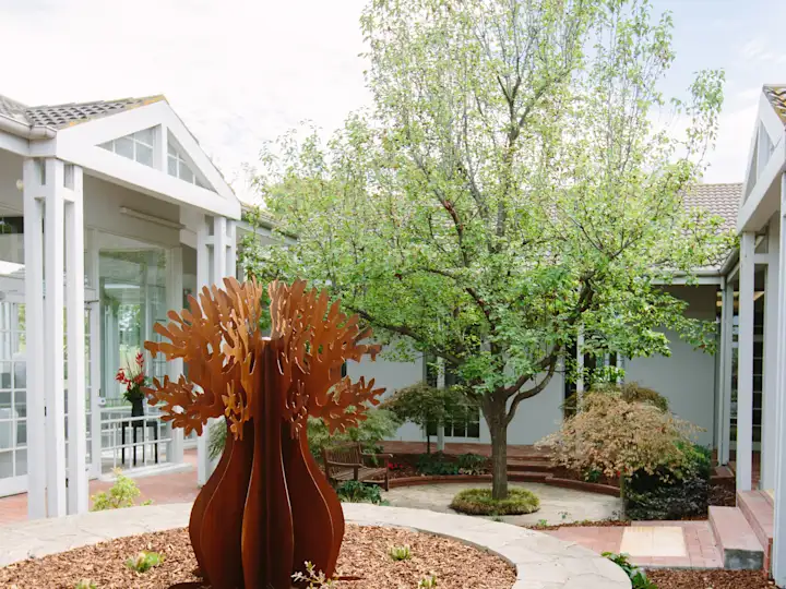 Sculpture of a tree in the courtyard between the Chapel of Peace and the Chapel of Repose at Altona Memorial Park