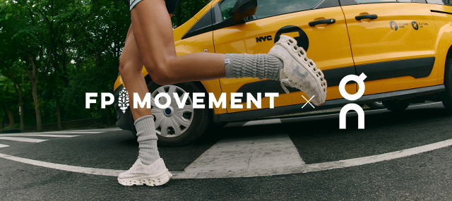 Person in white sneakers and gray leg warmers running across crosswalk with yellow taxi in background, FP Movement
