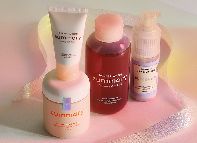 Four Summary brand skincare products arranged on pink surface: dream