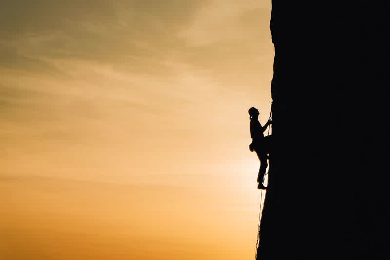 A person climbing a mountain
