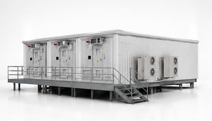 E-House unit on a raised steel platform with stairs