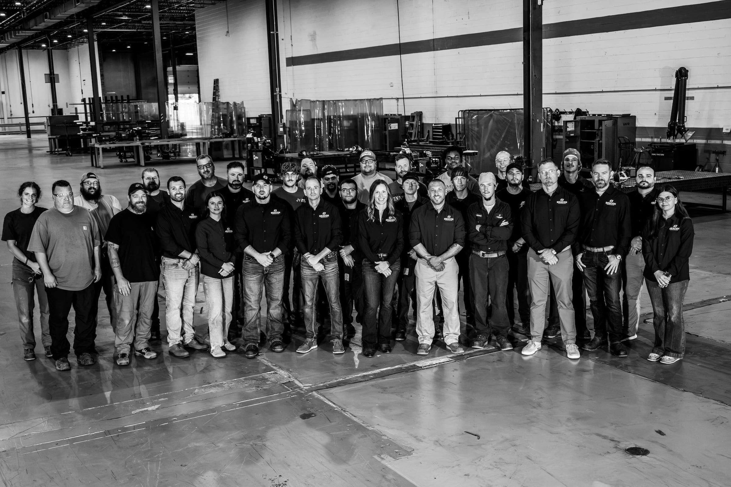 The whole Beacon Modular team standing together on the plant floor