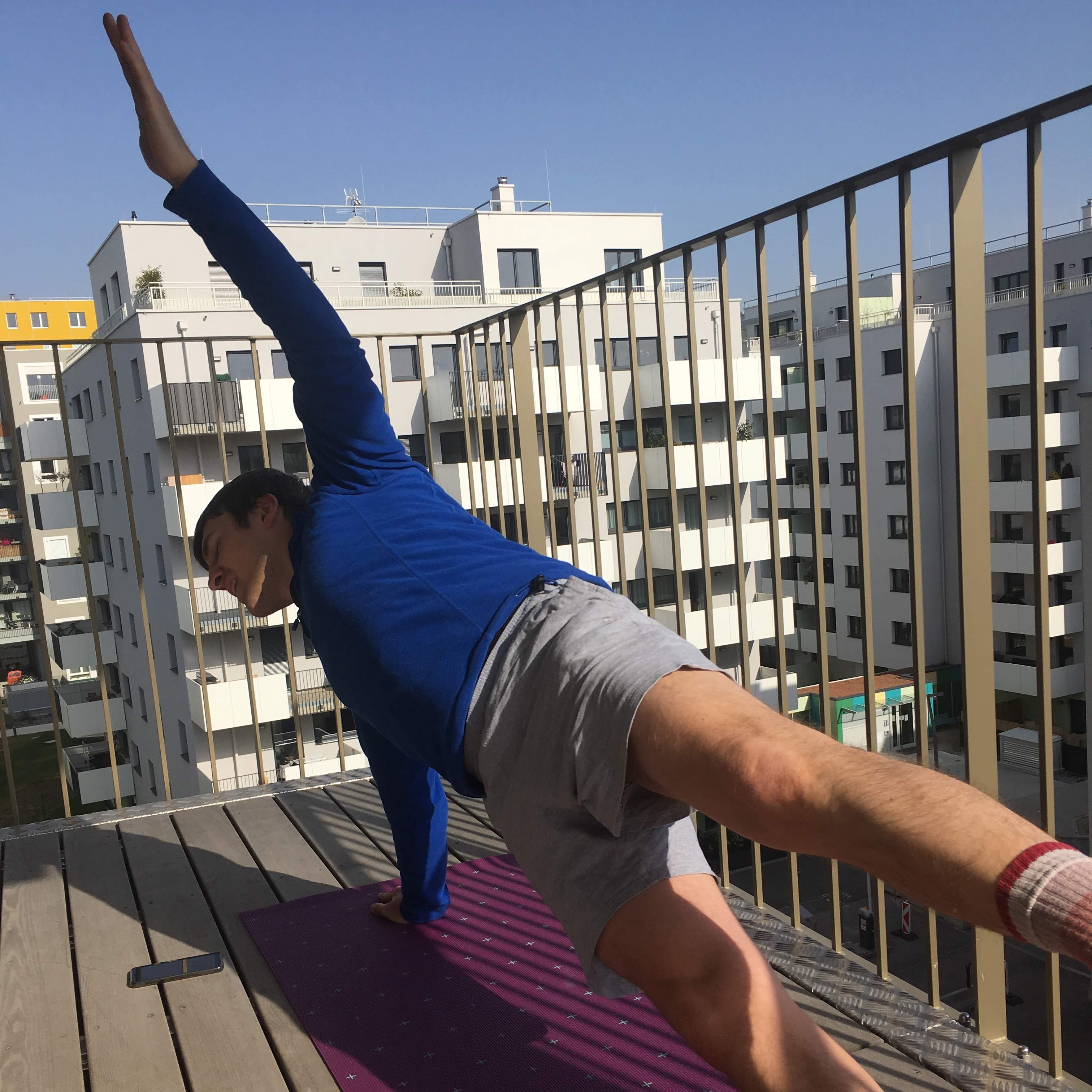 Me on my balcony doing a side plank.