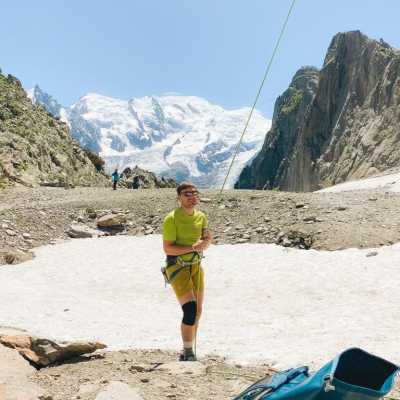 Me belaying in Chamonix with Mont Blanc in the background