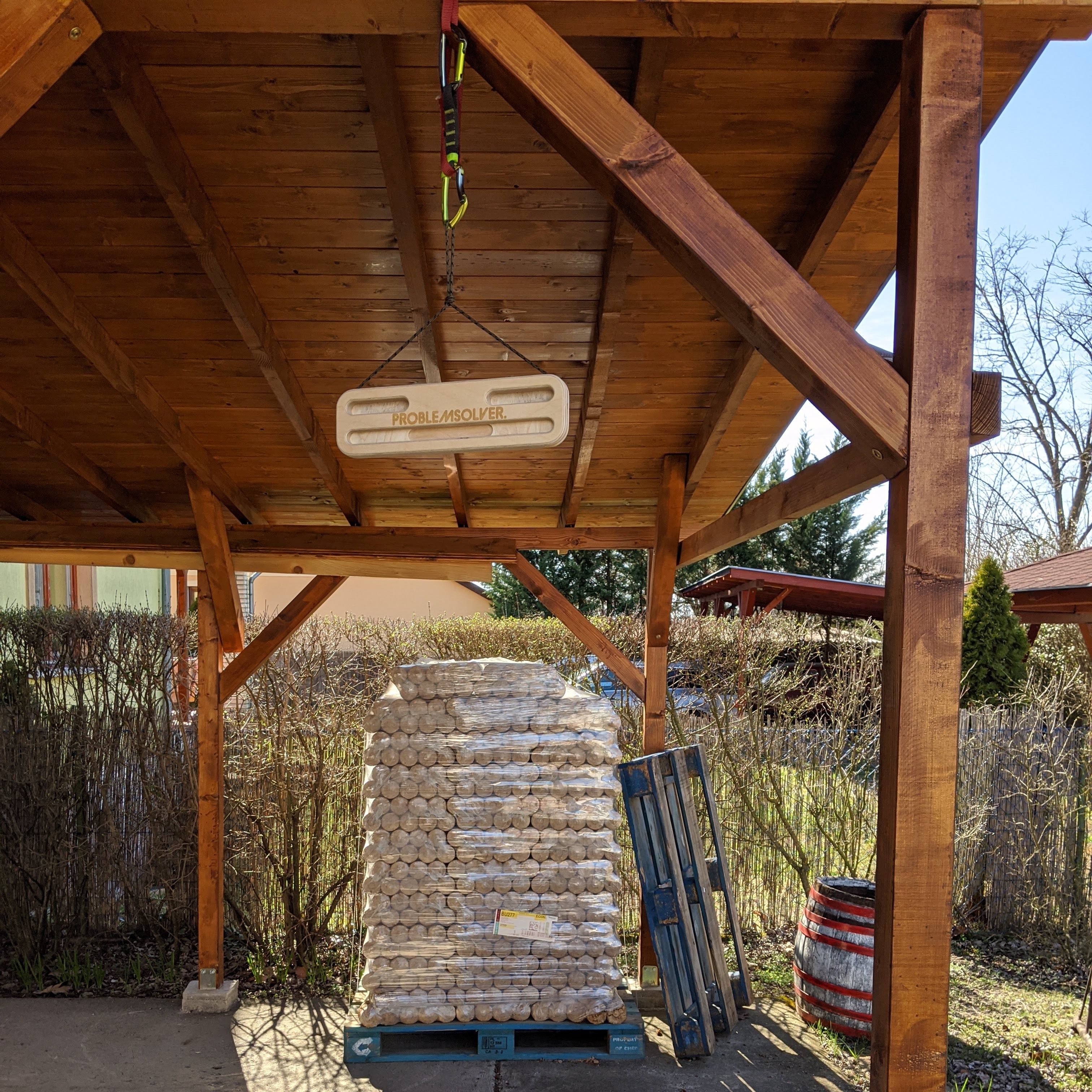 A Problemsolver fingerboard is hanging from the ceiling.