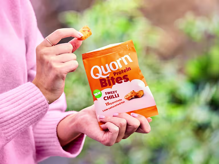 Quorn Sweet Chilli Protein Bites in a pack against a green, natural background