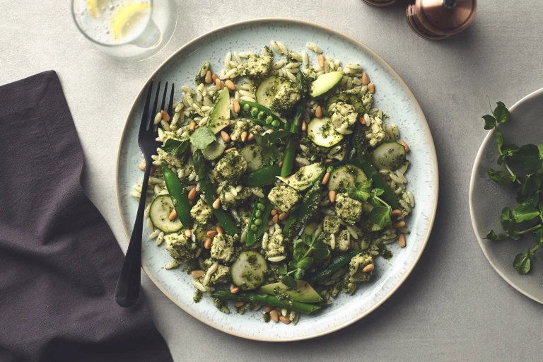 A pesto pasta salad with peas, courgette, asparagus, avocado, and Quorn Pieces.