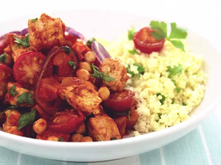 Vegetarian Moroccan tagine with Quorn Pieces, chickpeas, tomatoes and red onion served with fluffy couscous
