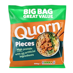 A bag of Quorn Pieces showing the prepared product and information on an orange and charcoal background.