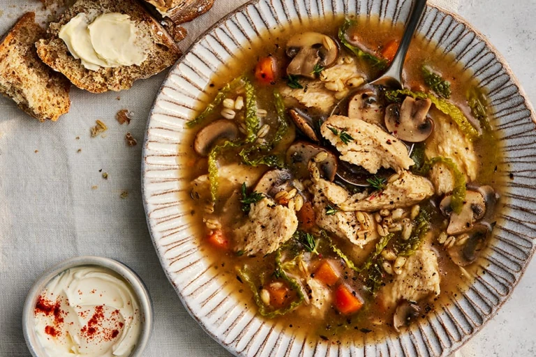 Quorn chicken and mushroom soup with vegetables in a bowl