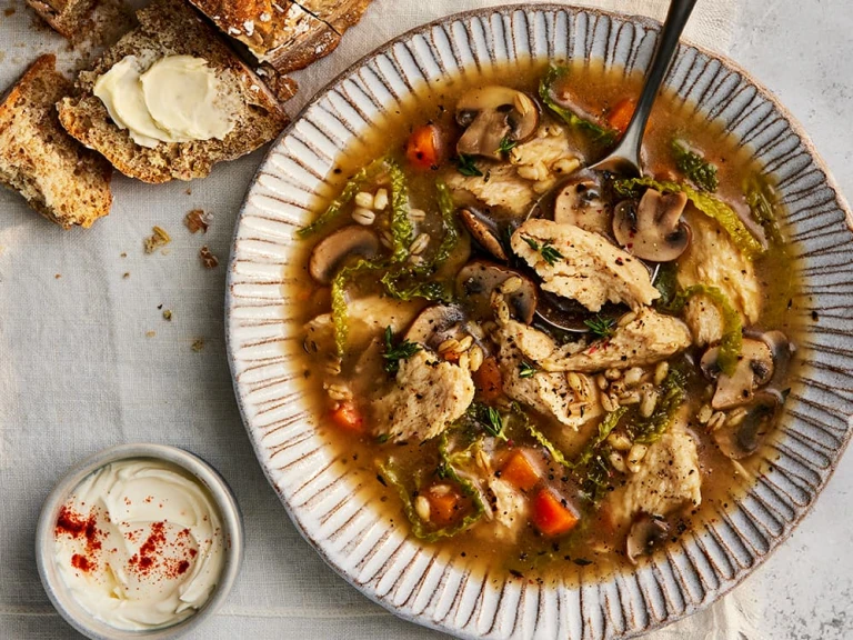 Quorn chicken and mushroom soup with vegetables in a bowl