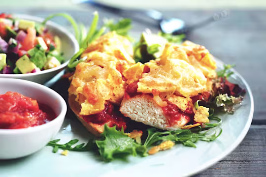 Quorn Vegetarian Fillet Nachos with salsa and cheese, served on a plate