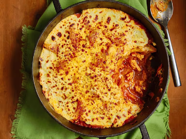 One Pan Quorn Vegetarian Chicken Lasagne with a small slice missing to show the filling.