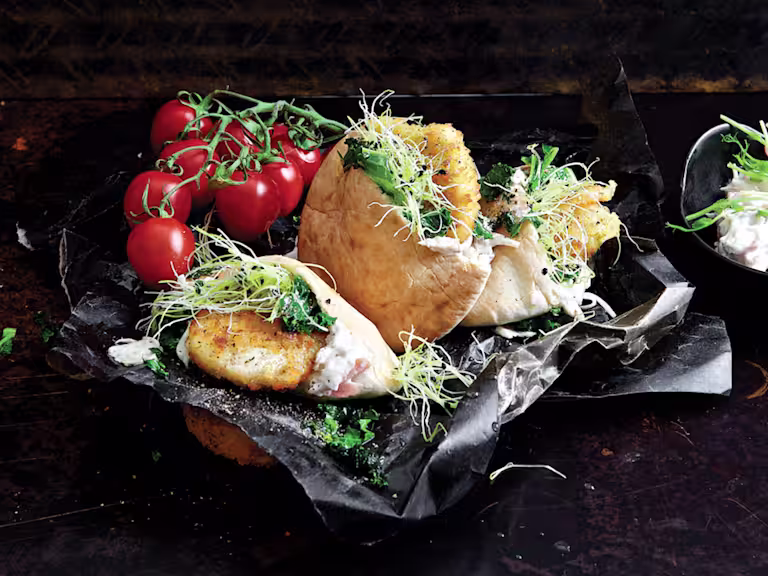 Easy healthy meal made with Quorn Escalopes stuffed in a pita with mozzarella and pesto with a side of coleslaw and tomatoes