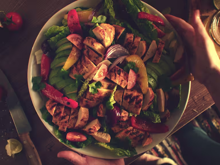 Quorn Veggie Fajita Salad, made with Quorn Fillets, peppers, avocado, tomatoes, onion and lettuce, served in a bowl