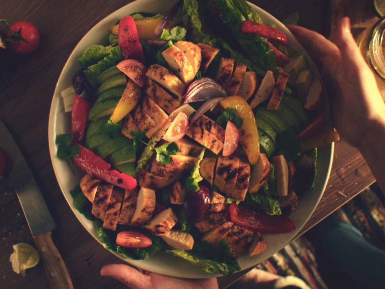 Quorn Veggie Fajita Salad, made with Quorn Fillets, peppers, avocado, tomatoes, onion and lettuce, served in a bowl