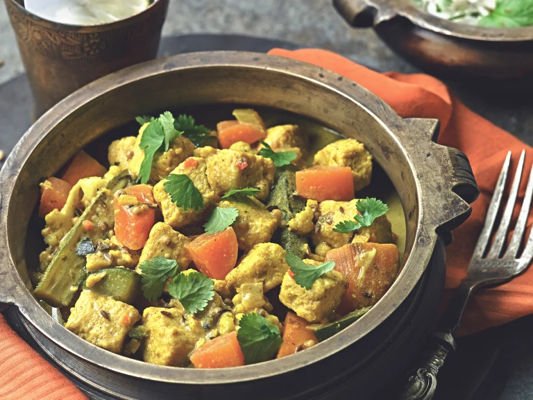 A bowl of Keralan curry made Quorn pieces, vegetables and coconut milk.