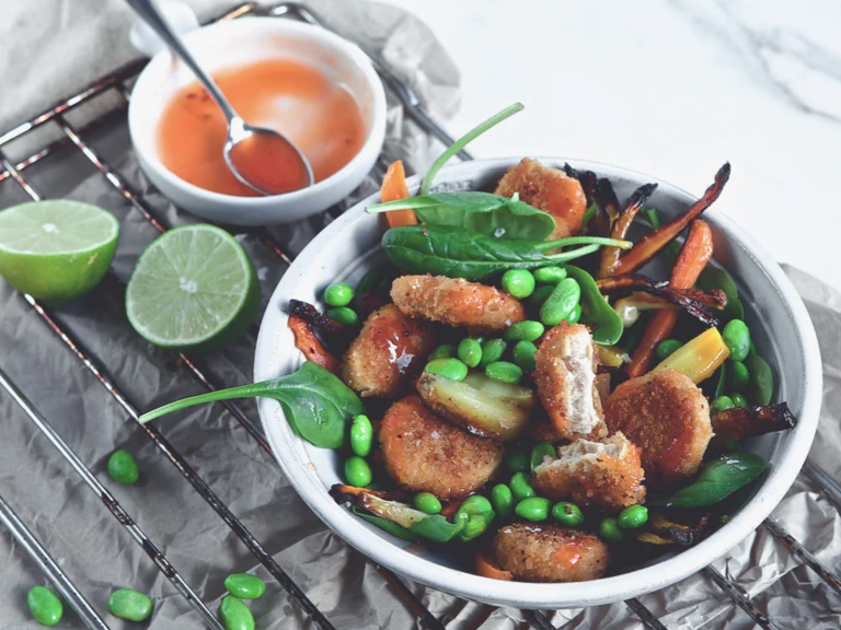 Quorn Vegan Nugget Bowl, made with Quorn Vegan Nuggets, edamame beans, spinach, parsnip and carrots, served with tomato dip and lime.