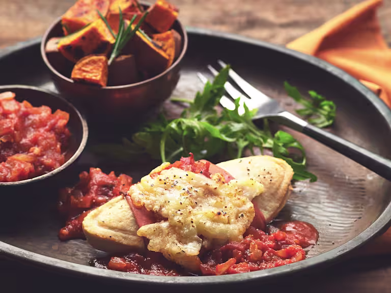 Hunter's Chicken made with meat free Quorn Fillets and Quorn Vegetarian Ham served with cheese and barbeque sauce on a plate