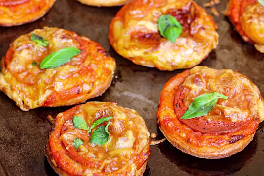 Four Mini Puff Pastry Vegan Pepperoni Pizzas.