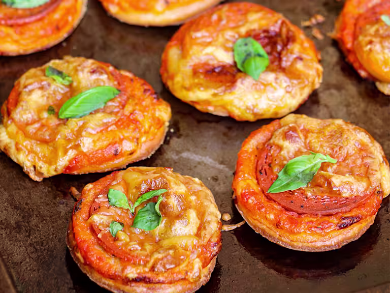 Four Mini Puff Pastry Vegan Pepperoni Pizzas.