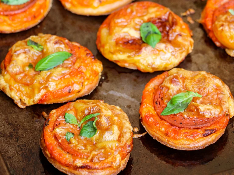 Four Mini Puff Pastry Vegan Pepperoni Pizzas.