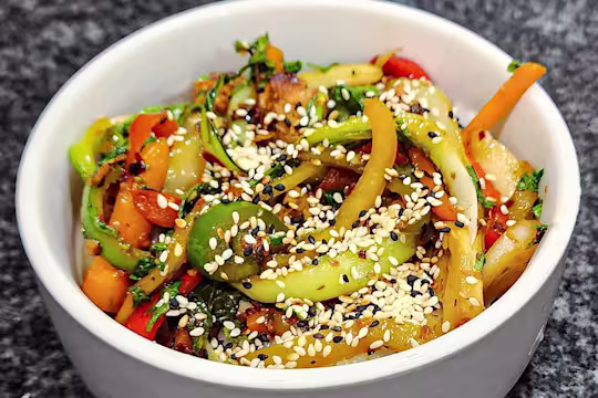 Asian-Style Quorn vegetarian Stir fry in a bowl sprinkled with sesame seeds.