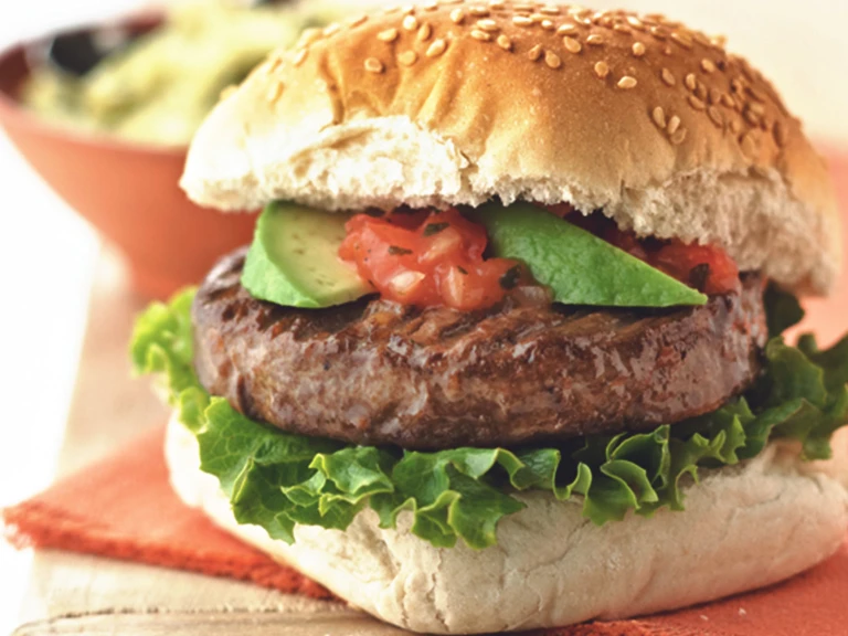 Quorn Veggie Burger, made with Quorn Classic Beef Style Burger, and served in a bun with avocado, tomato, onion and lettuce