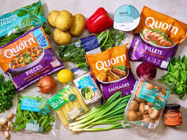 Quorn products in packaging amongst healthy products from ASDA including fresh vegetables, yoghurt and curry paste.