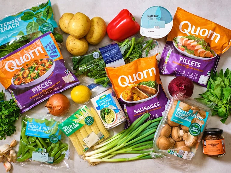 Quorn products in packaging amongst healthy products from ASDA including fresh vegetables, yoghurt and curry paste.