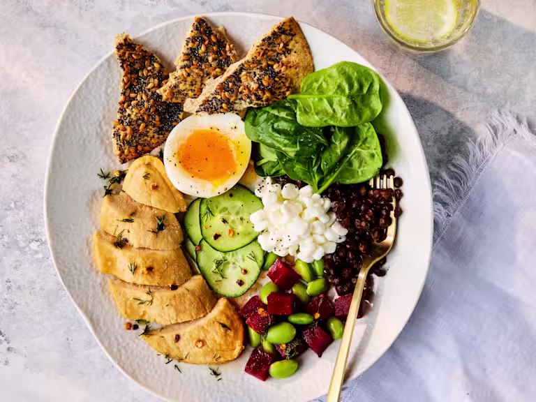 Plated Scandi Protein Bowl with Quorn Fillets, a soft-boiled egg, cottage cheese, and mixed fresh vegetables.