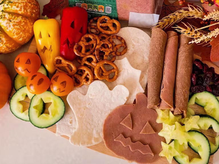 Vegan Halloween grazing board with Yorkshire ham and roast beef slices