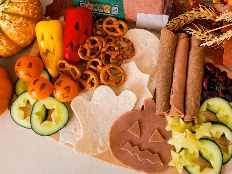 Vegan Halloween grazing board with Yorkshire ham and roast beef slices