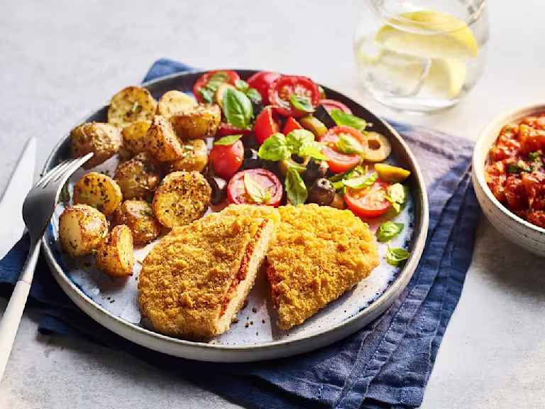 Quorn Mozzarella and Tomato Escapes with Italian potatoes and tomato and olive salad on the side